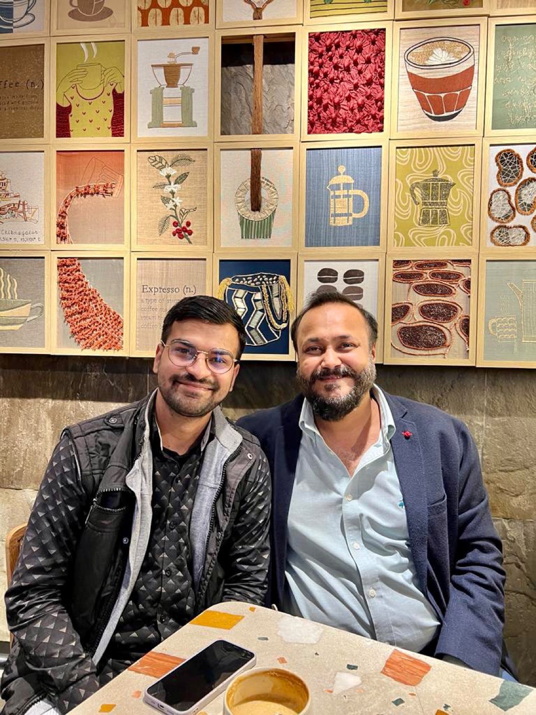 Gaurav Sir seated with a creator at a cafe