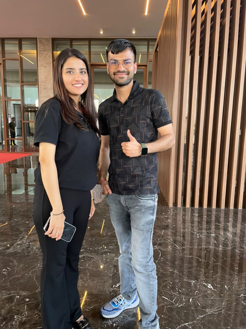 Gaurav Sir with a creator in a bright event lobby