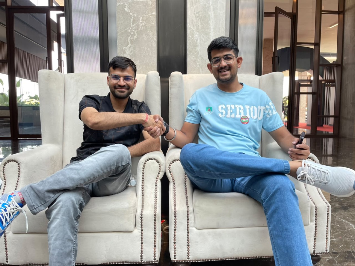 Gaurav Sir seated with a creator in a lounge